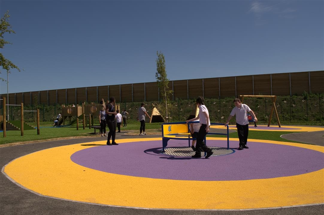 children playing on roundabout
