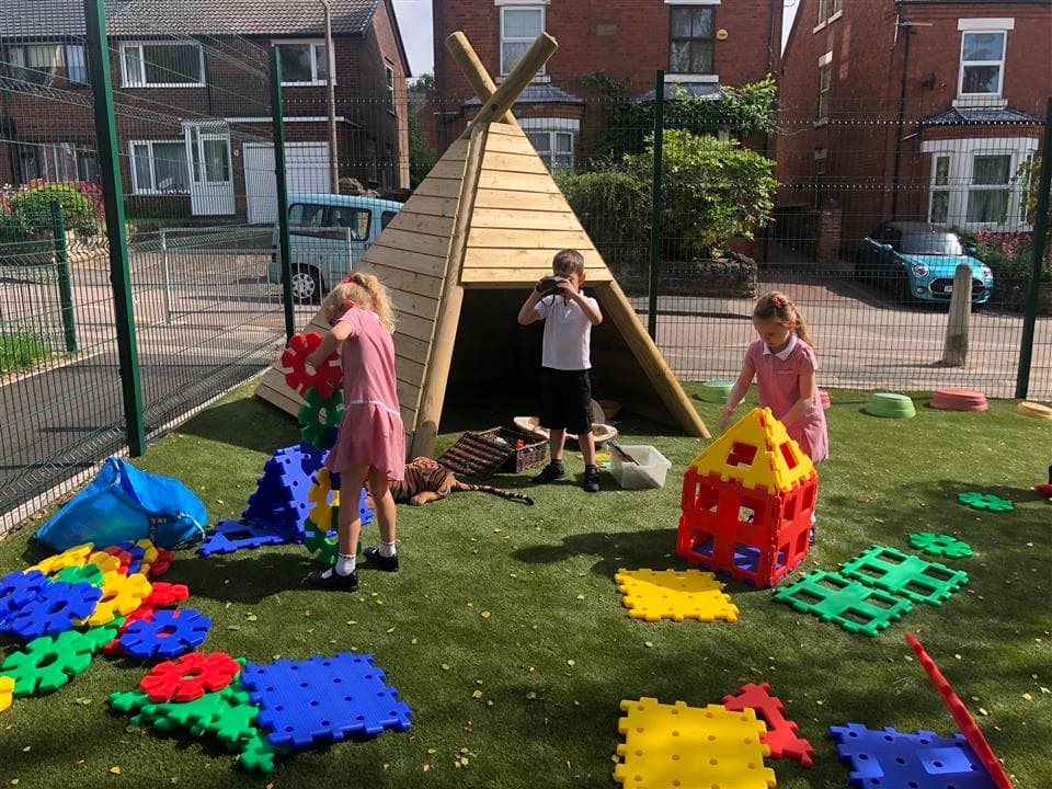 a picture of children underneath our wigwam