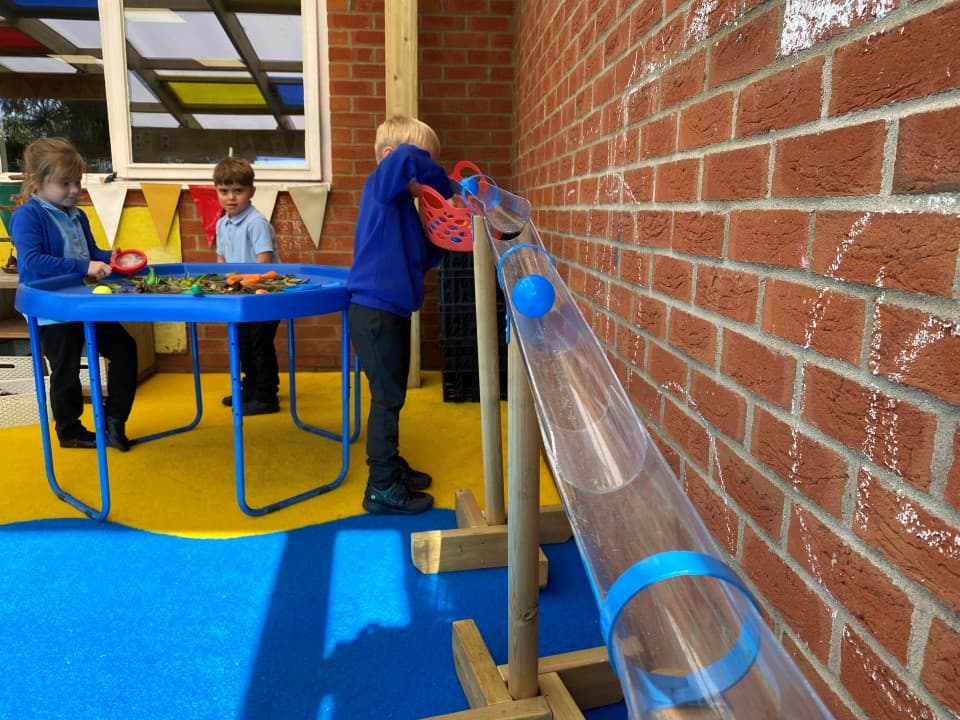 water channel with stands being played with by a child in the early years area