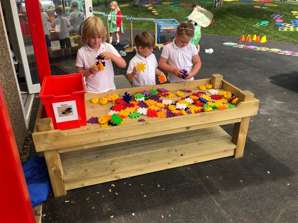 children playing on our construction table