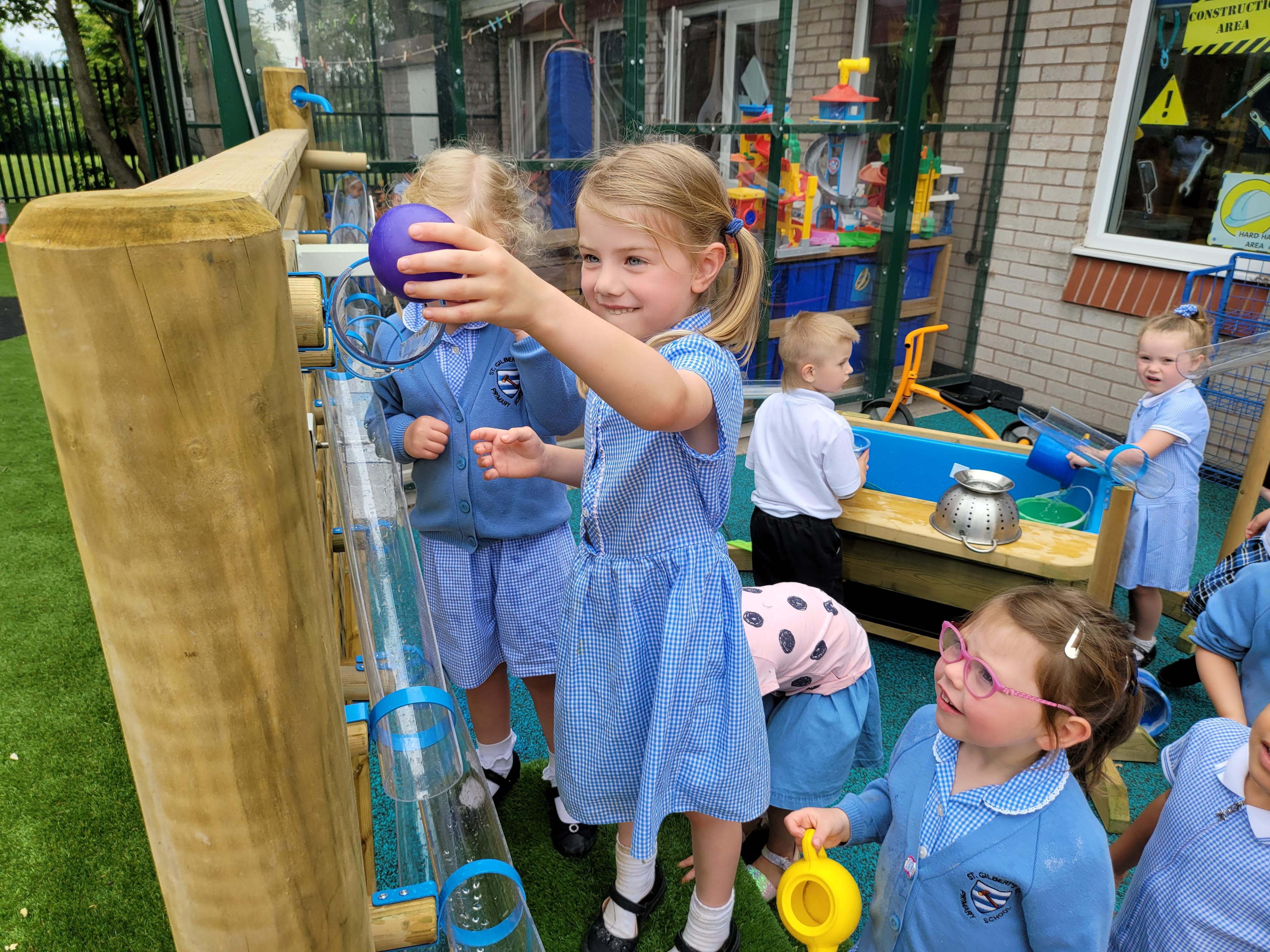 children playing on water wall