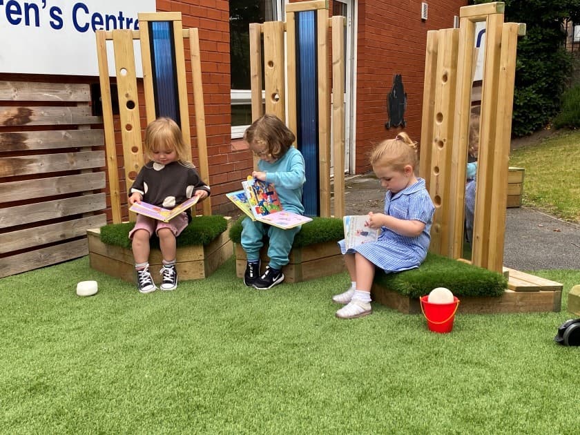 children sit and use the walk and talk seating circle as their quiet zone