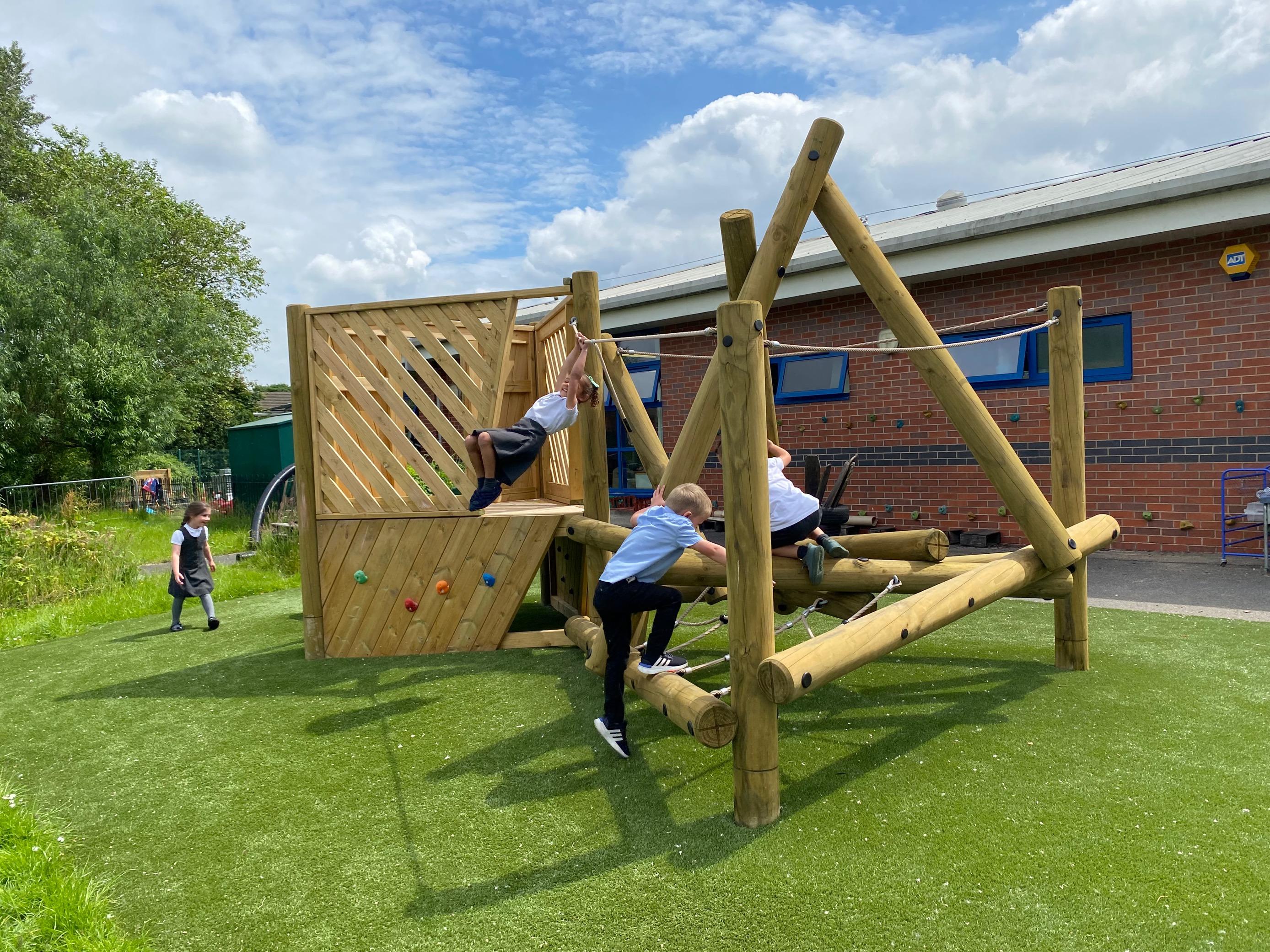 Playframe for primary school playgrounds with a platform and slide 