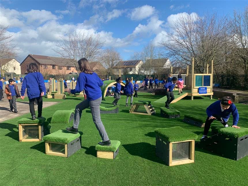 A class of children climbing across the blocks of our get set go blocks