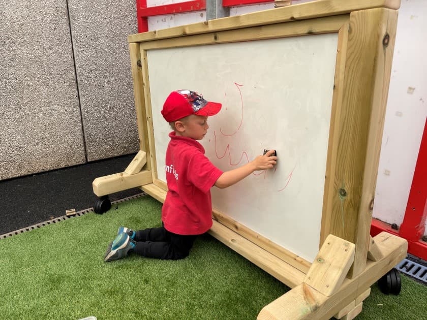 Children can embrace their inner creativity with this moveable whiteboard panel