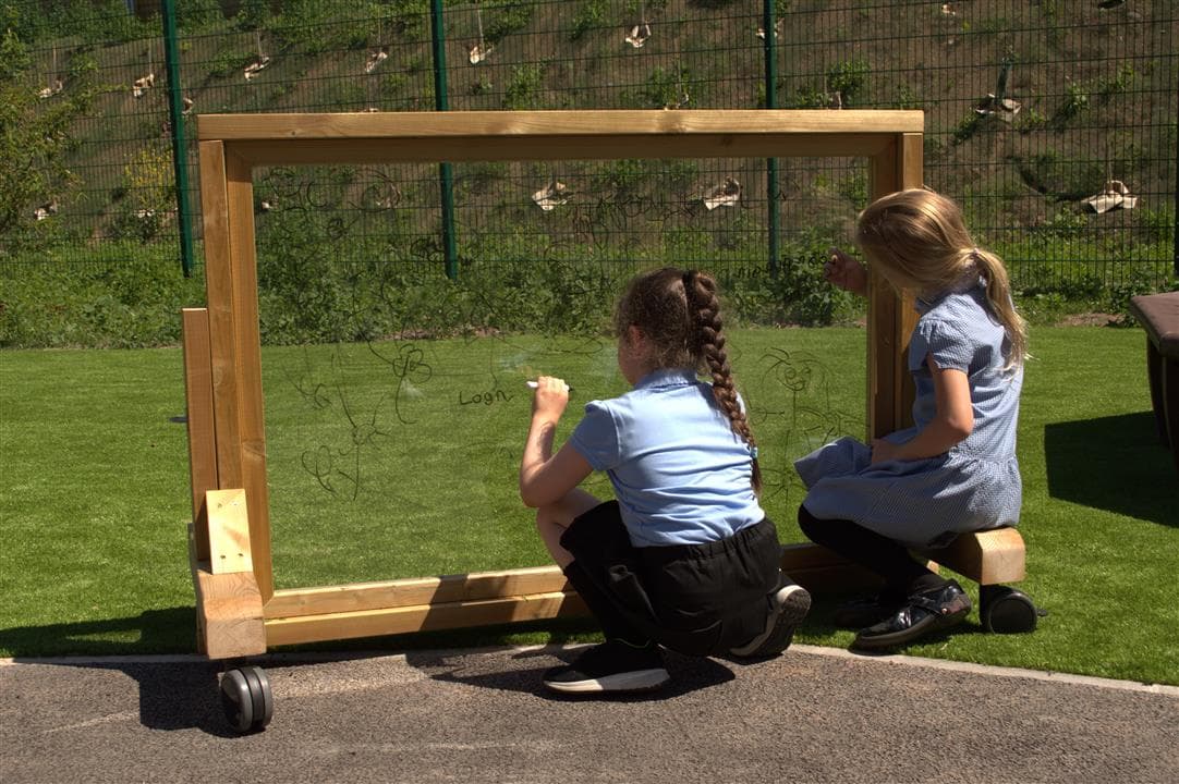 children playing on paint pannel