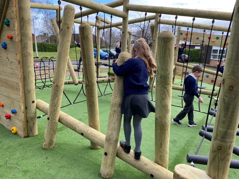 children cross the incline beam on the grizedale forest circuit