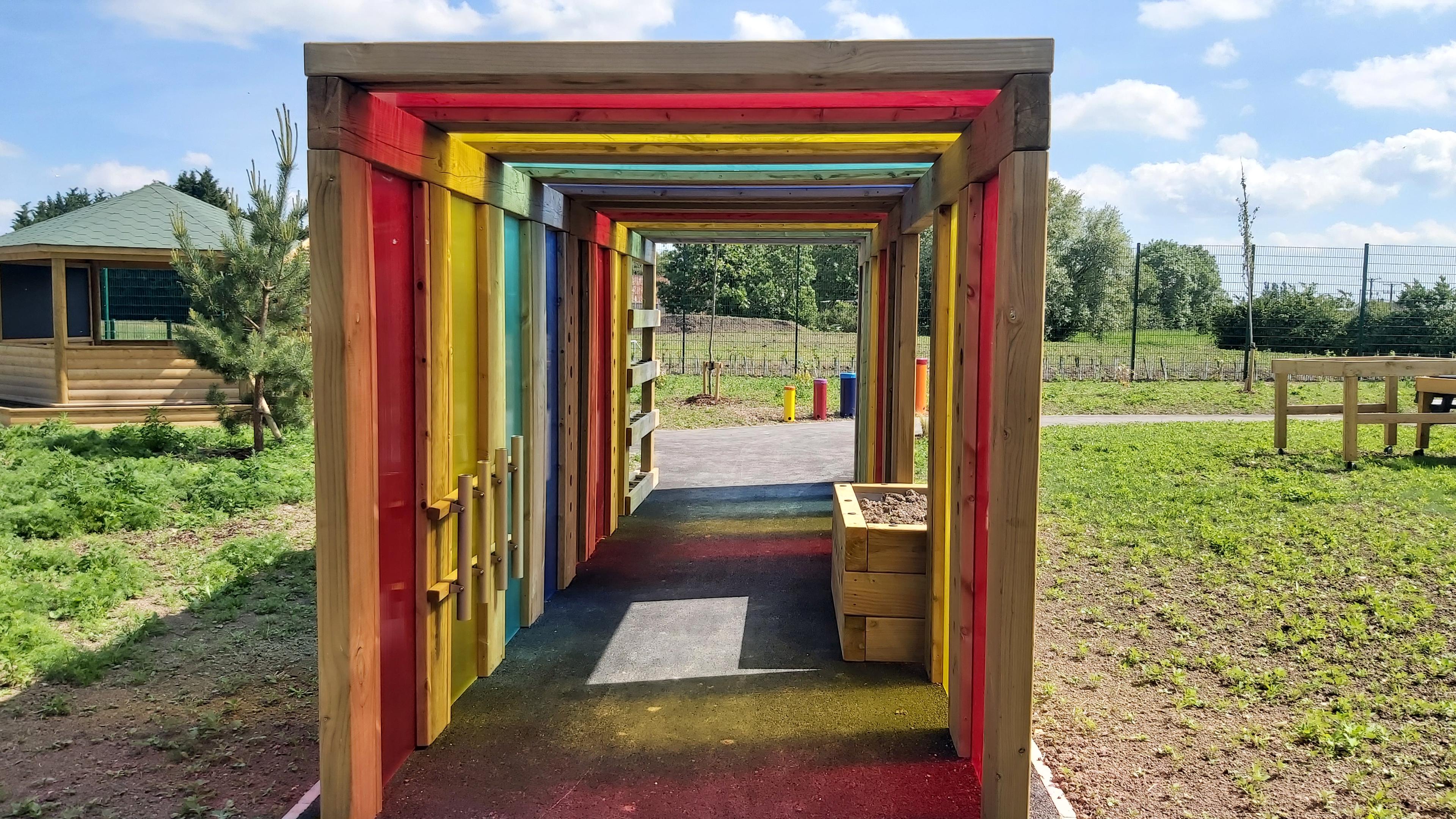 A side view of the sensory tunnel in a school playground