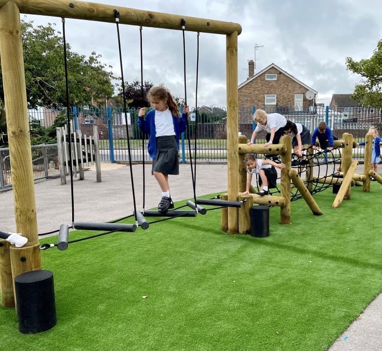 children crossing the zig zag traverse