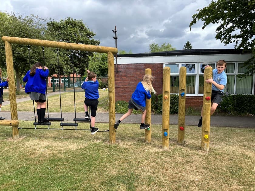 children build their body strength as they climb along the poles
