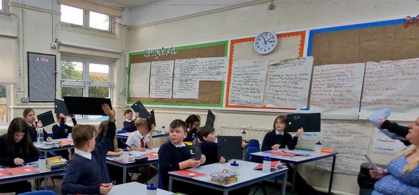 A class using the scribble boards in their classroom