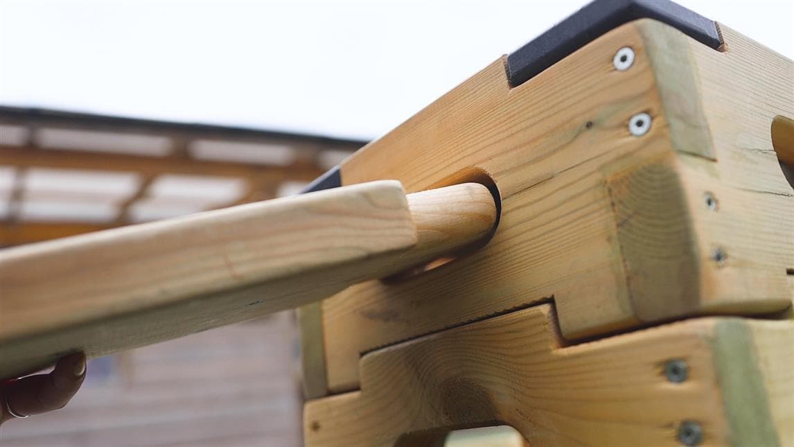 A plank slotting into the play builder block