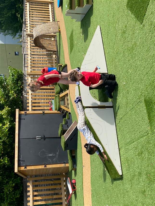 one young girl is sliding down the ramp on the up and under blocks 