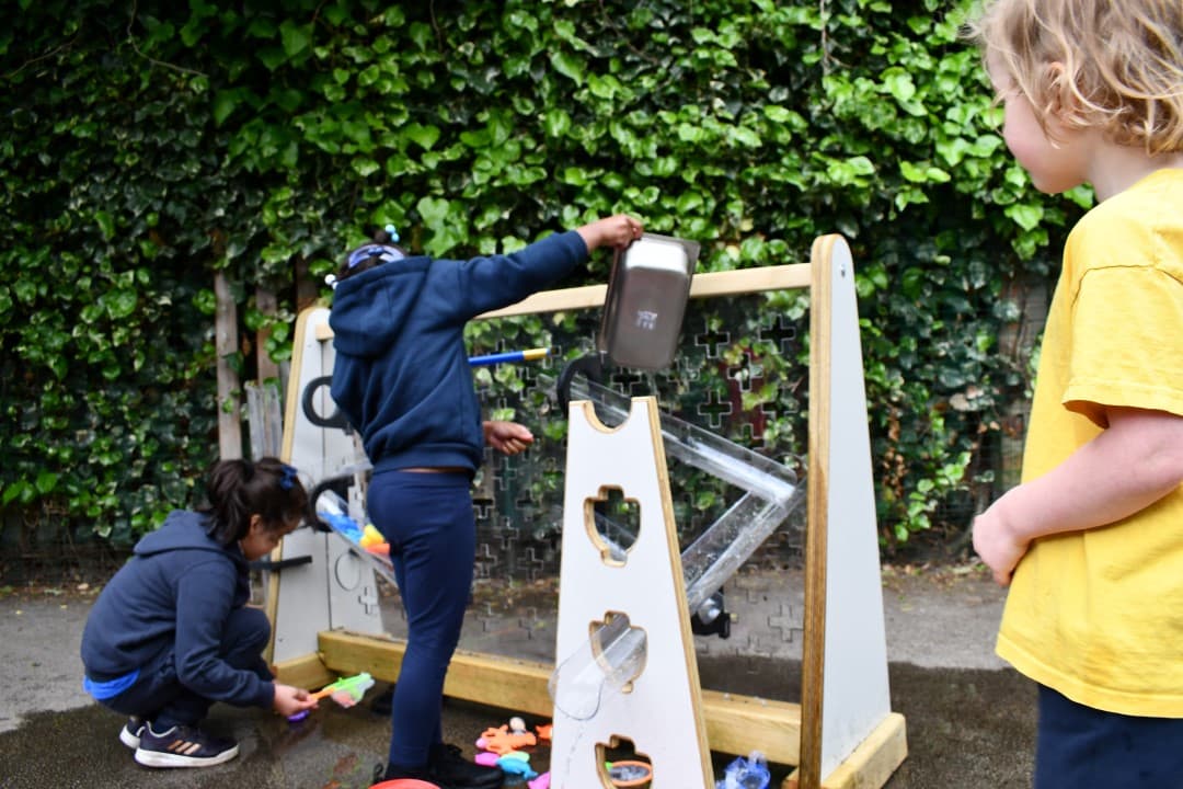 Children can work together to direct water along the channels