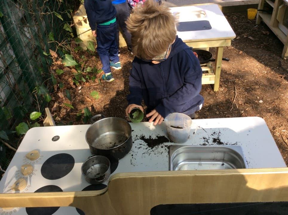 This set features a mud kitchen with and an island