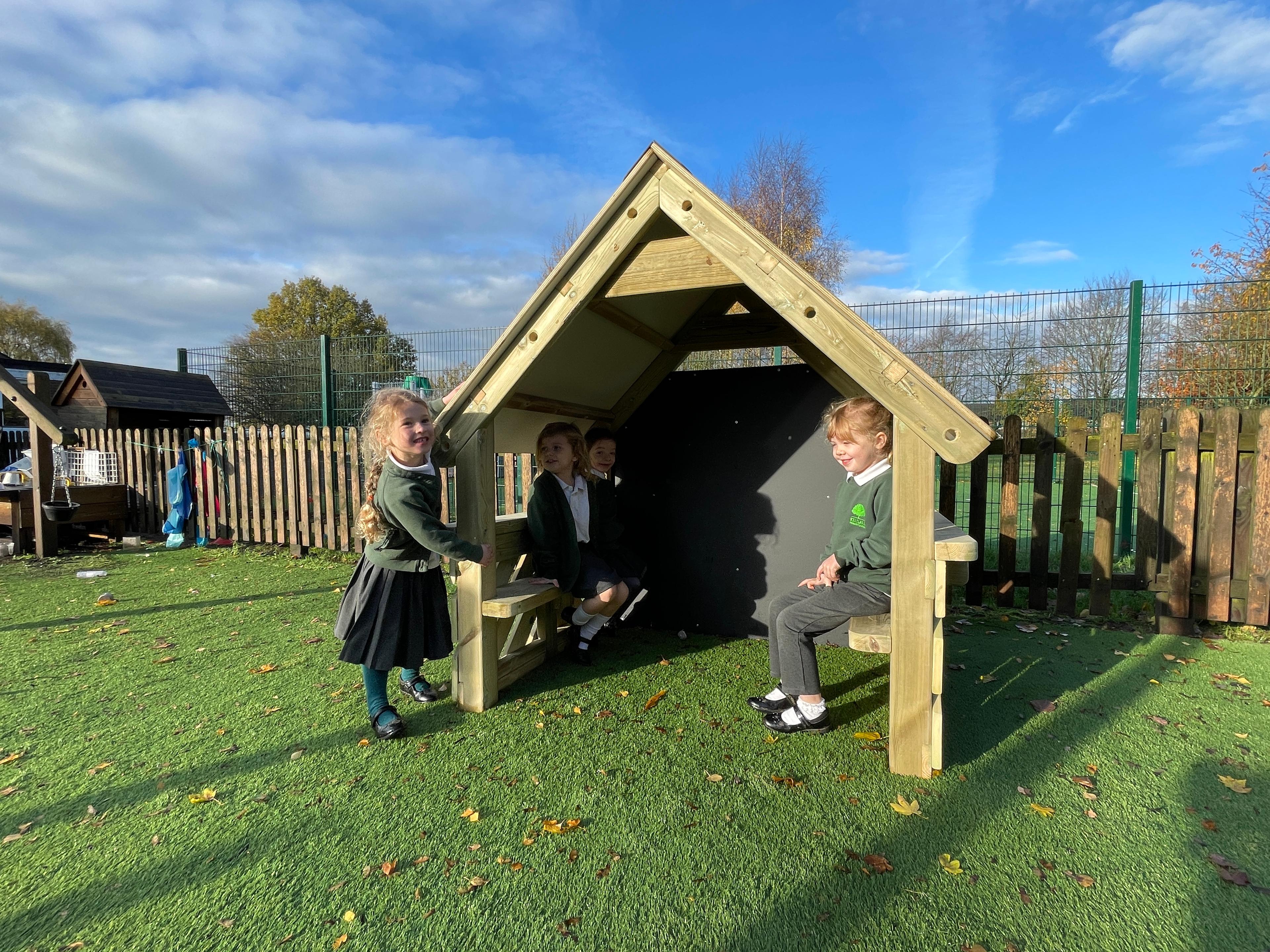 A small playhouse in a primary setting 