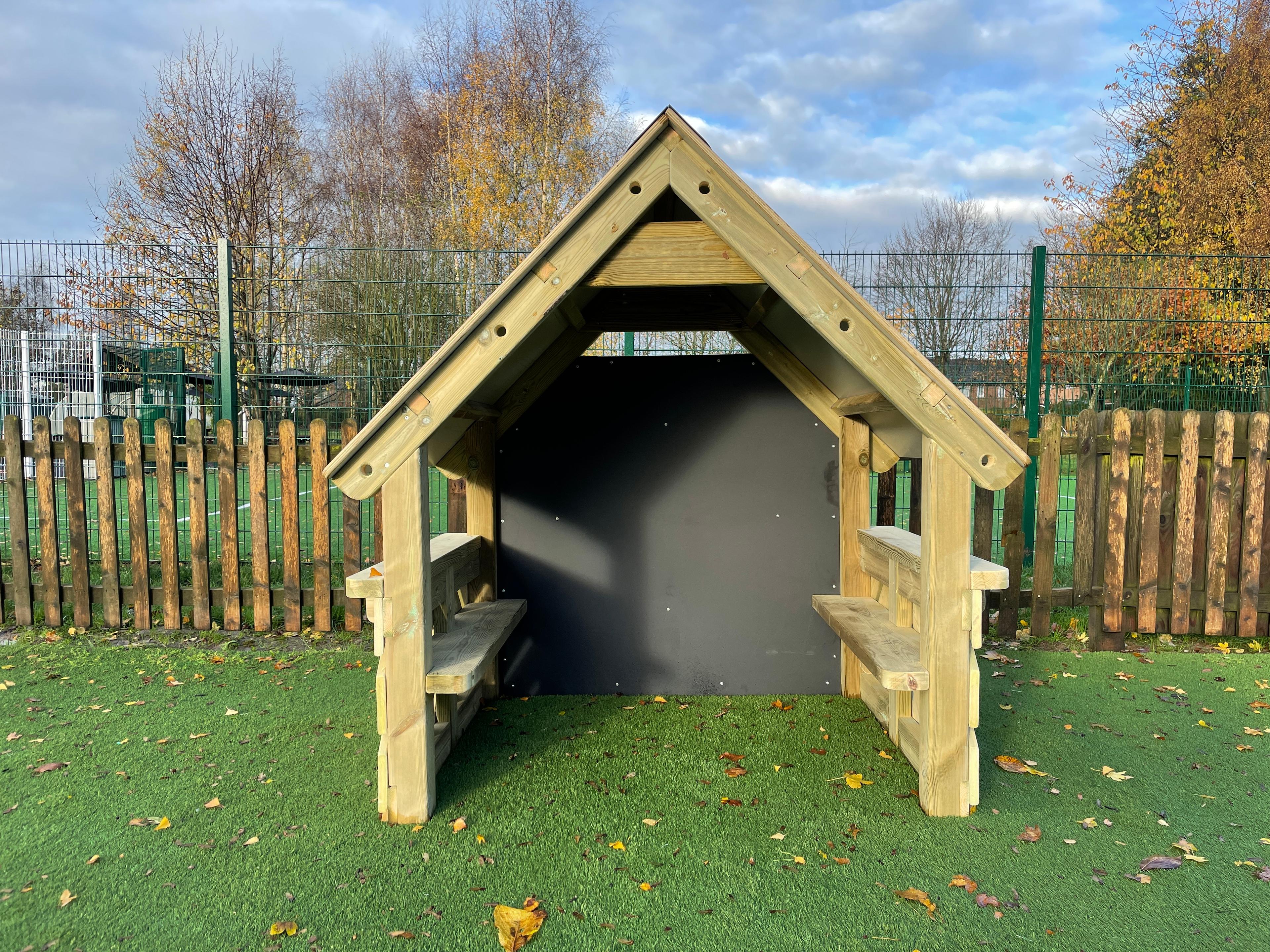 A front view of the small playhouse for primary school playgrounds