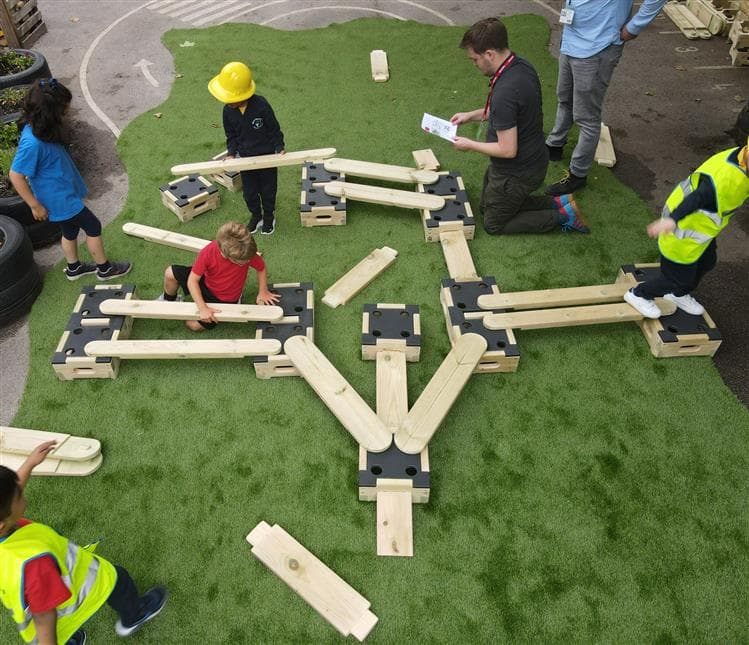 A birds eye view of children playing on the architect play builder set