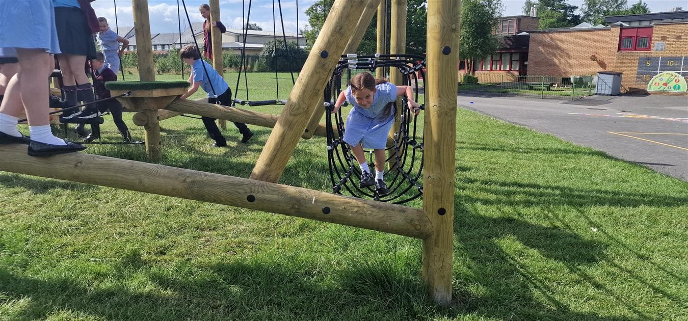 A climb through tunnel net on the climbing frame for schools