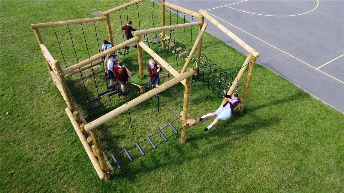An outdoor climbing frame for primary school playground settings