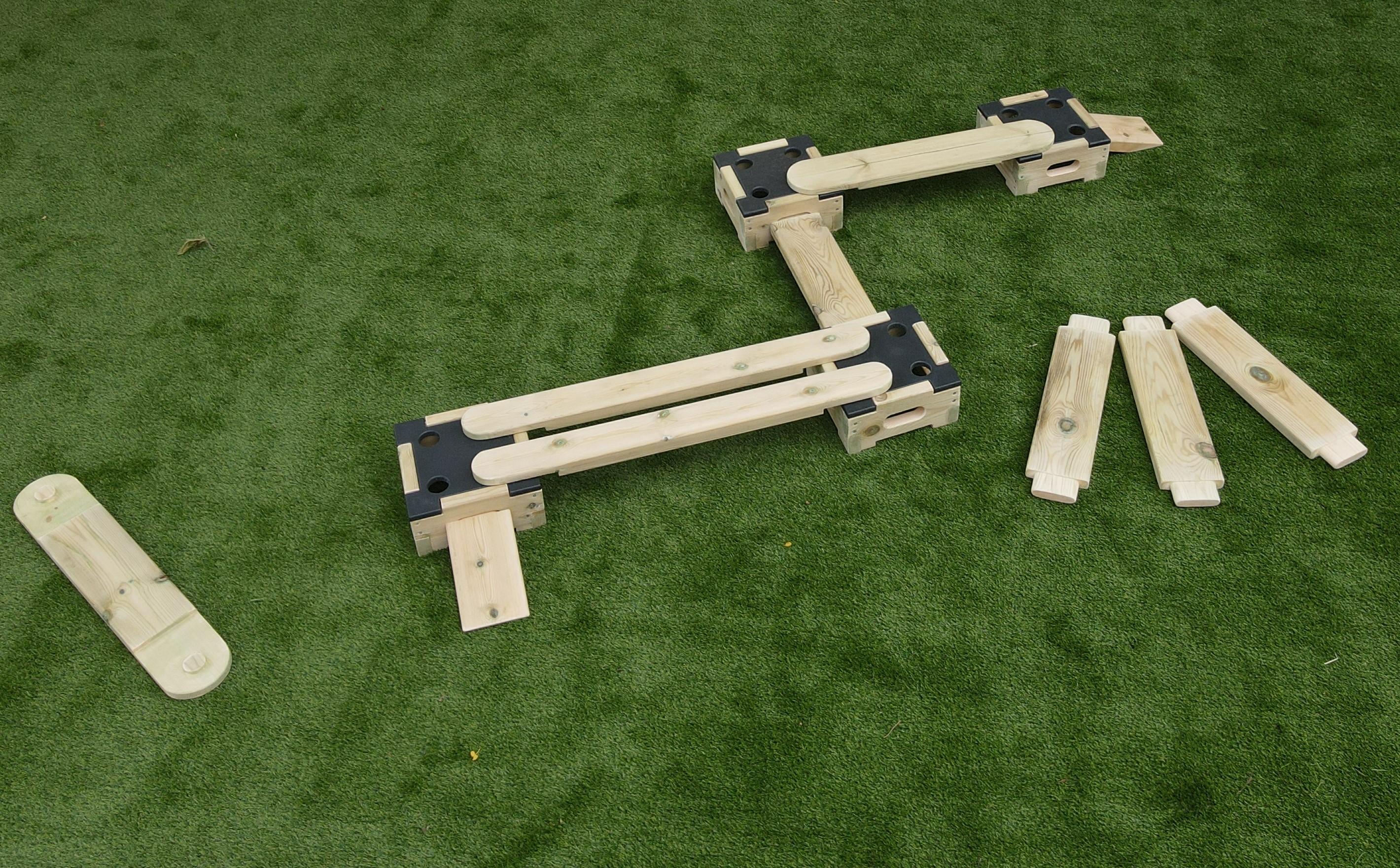 A birds eye view of planks and blocks in a playground setting