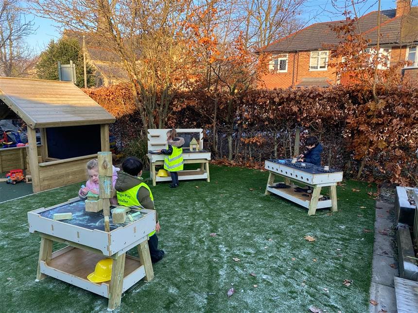 primary school children using the construction benches in their playground setting