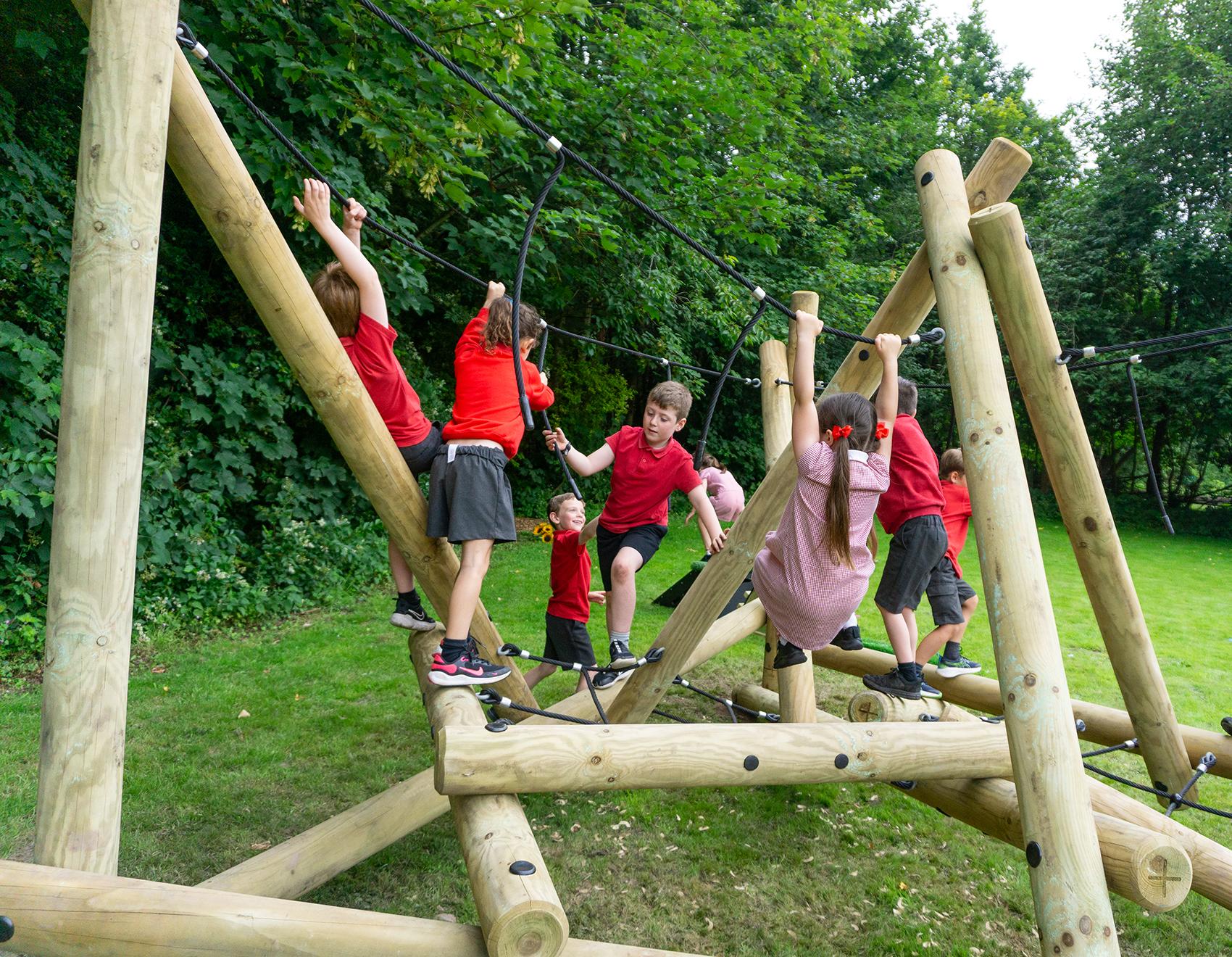 Early years children climbing on the Latrigg Mountain Climber.