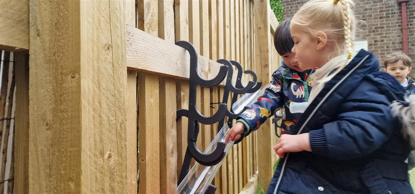 Outdoor water channel hooks for fencing