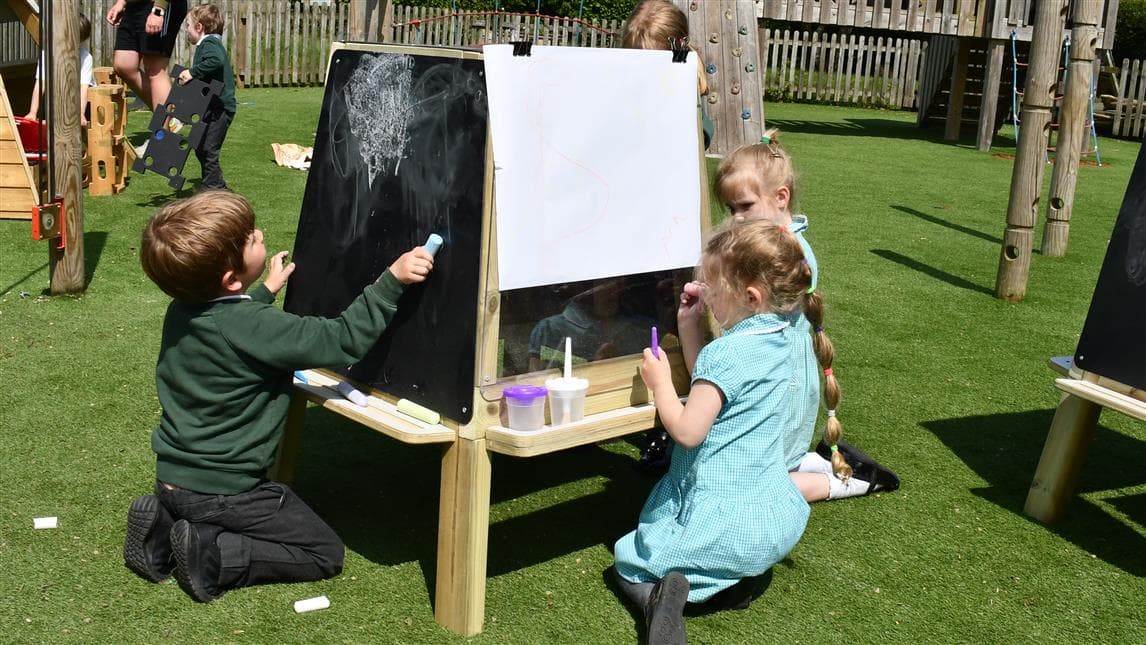 Multiple children can gather around this Art Easel at once and work cohesively
