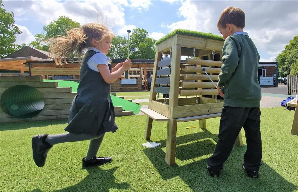 Children can work together around this easel
