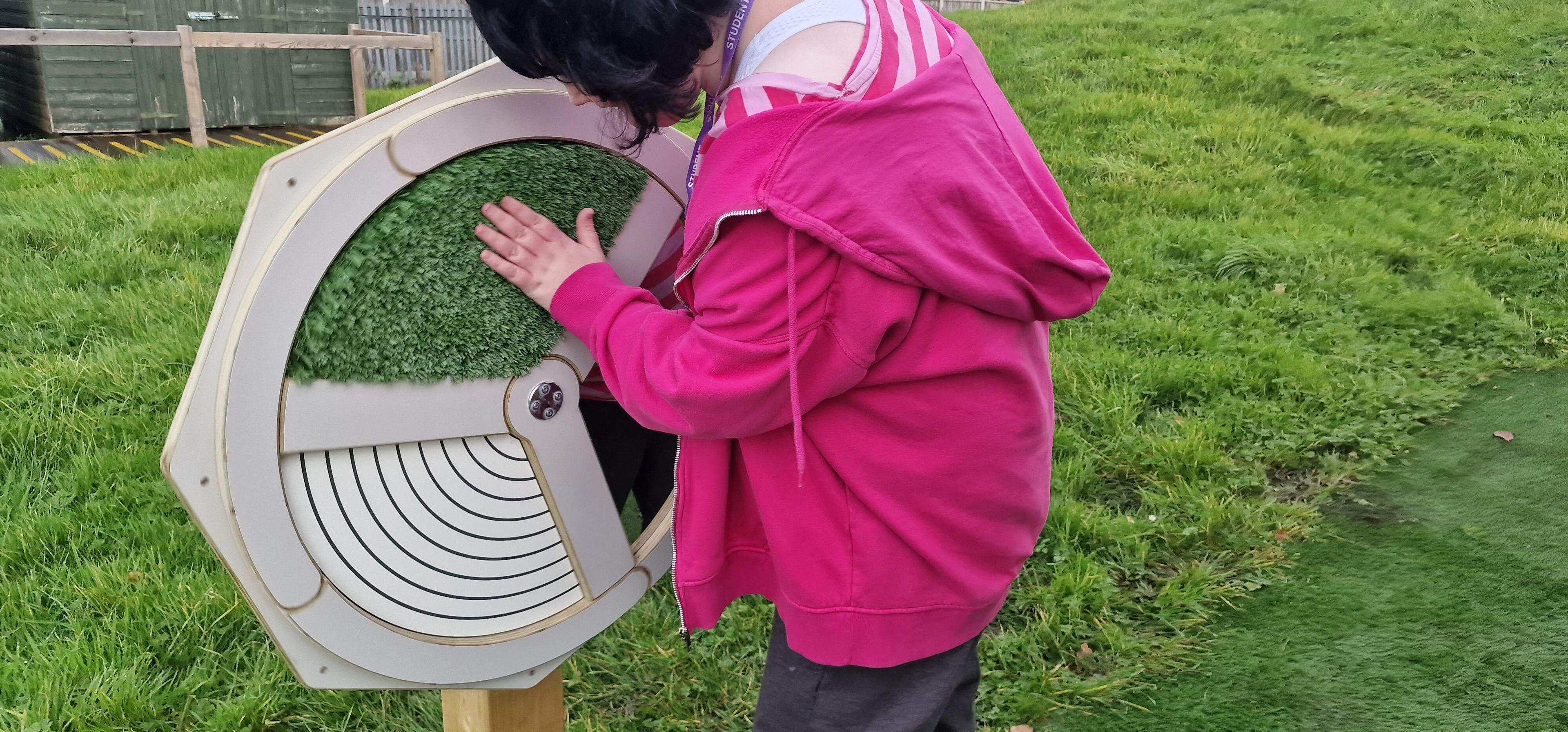 A girl playing with our touch sensory spinners