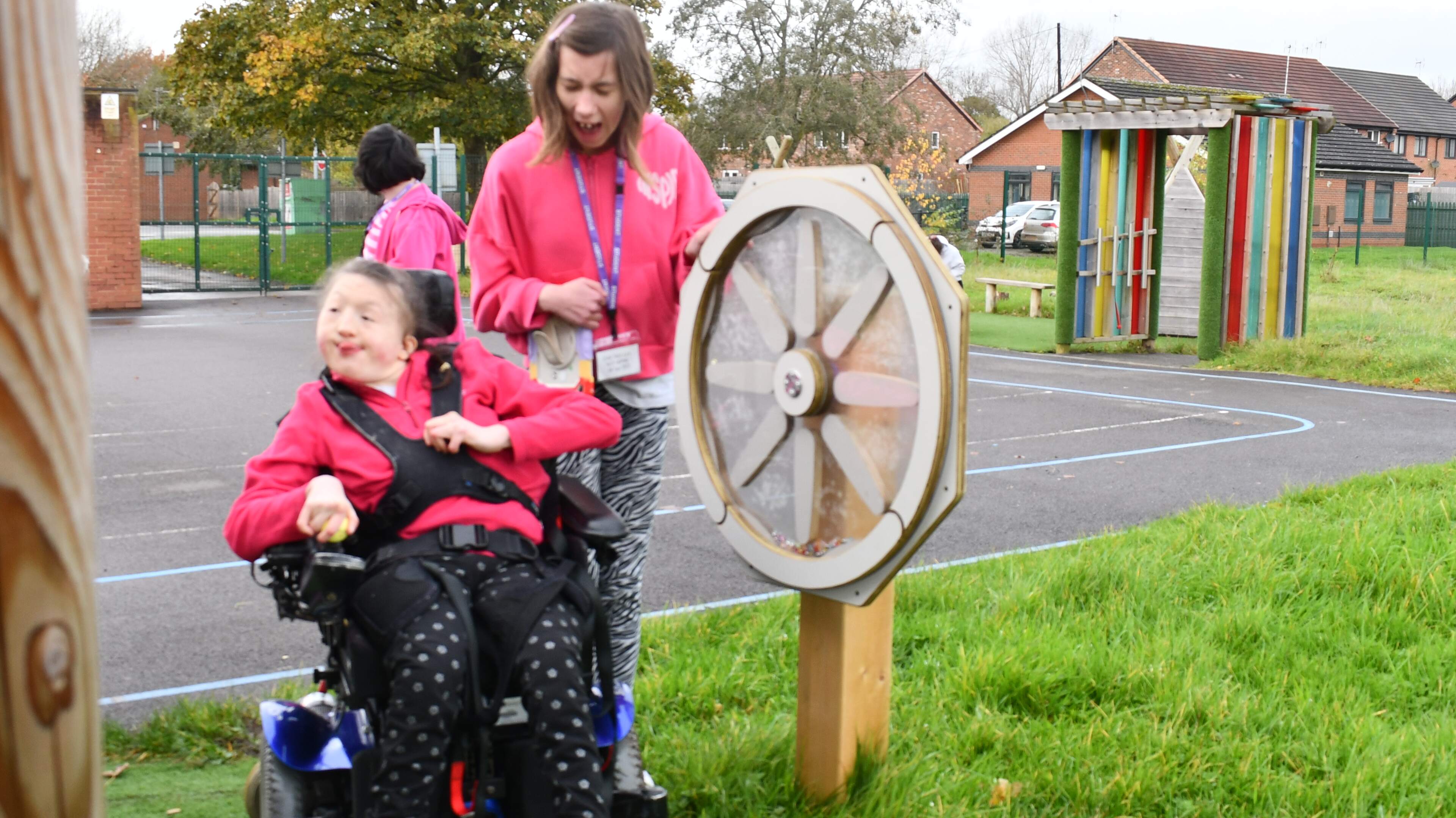 Girl in wheelchair playing on our sound sensory spinner