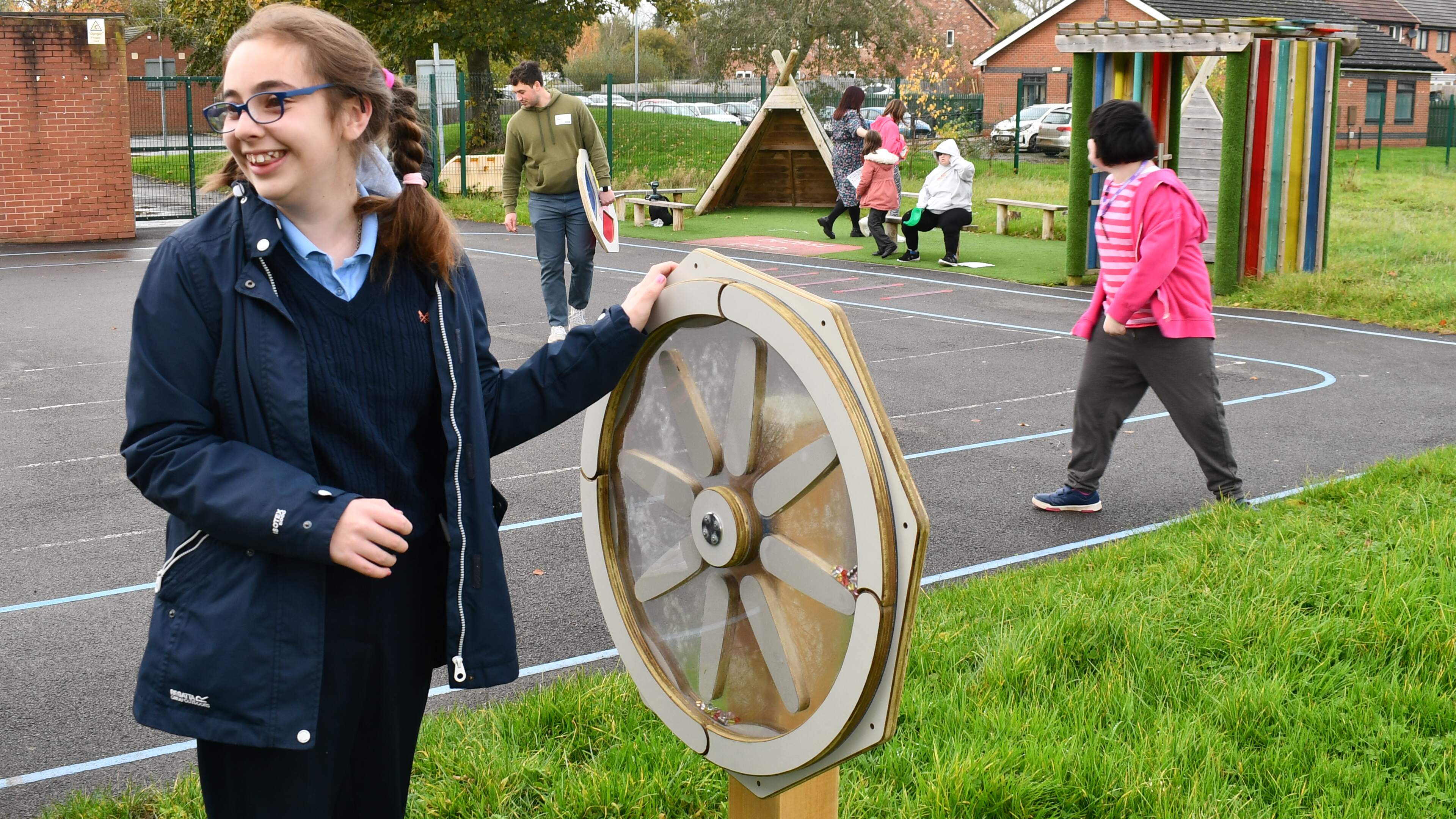Young girl spinning the sound sensory spinner