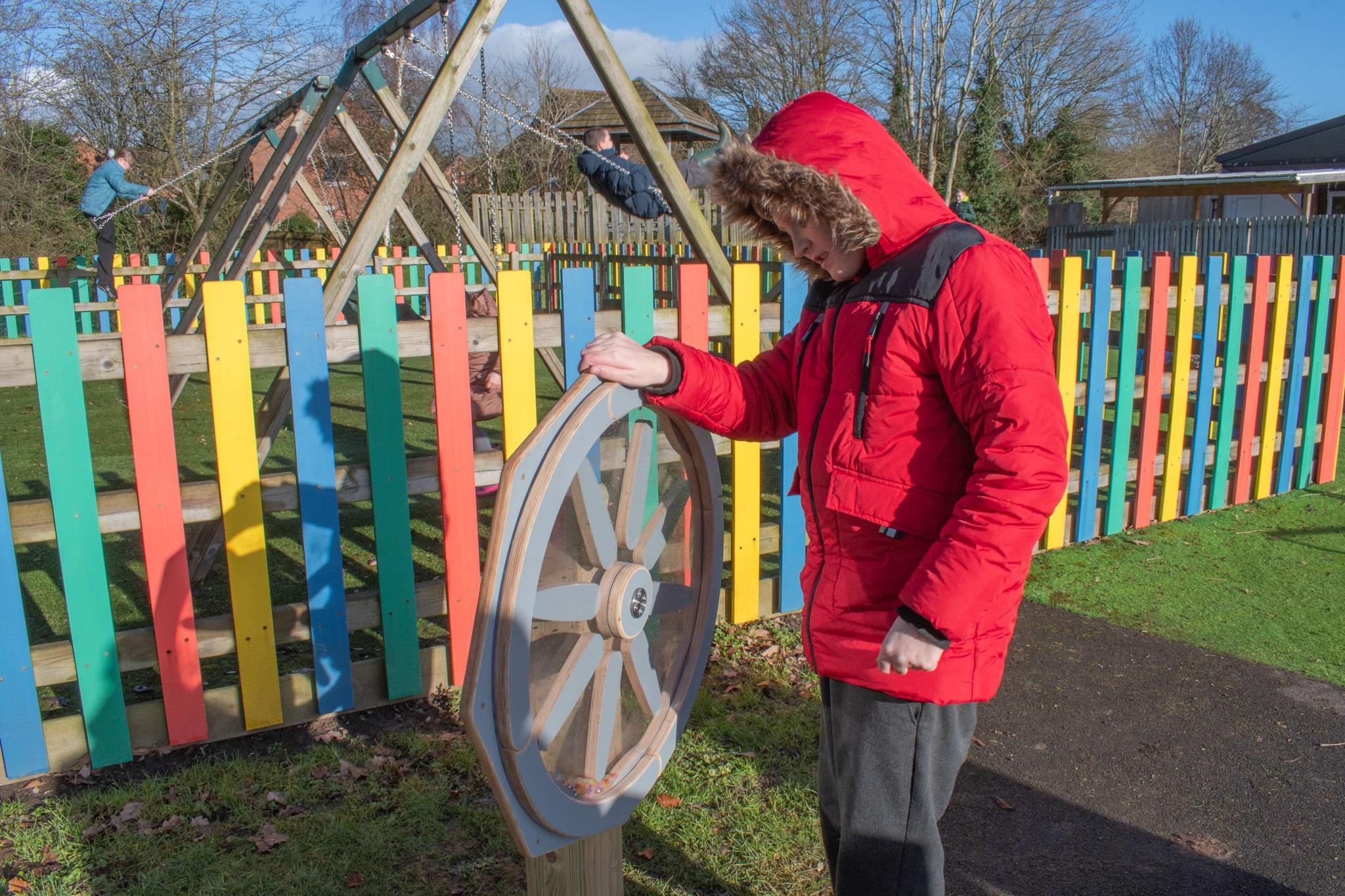 Boy Playing with Sound Sensory Spinner