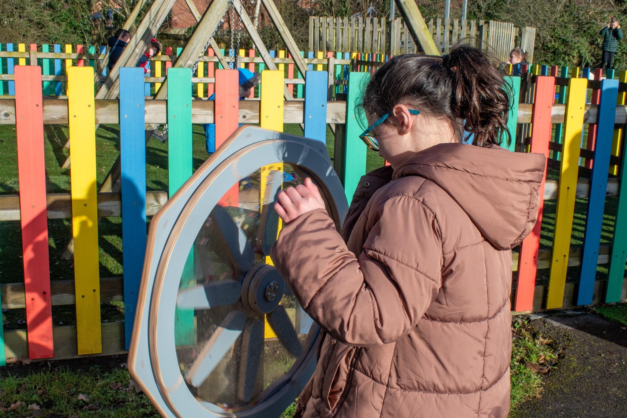Girl Playing with Sound Sensory Spinner