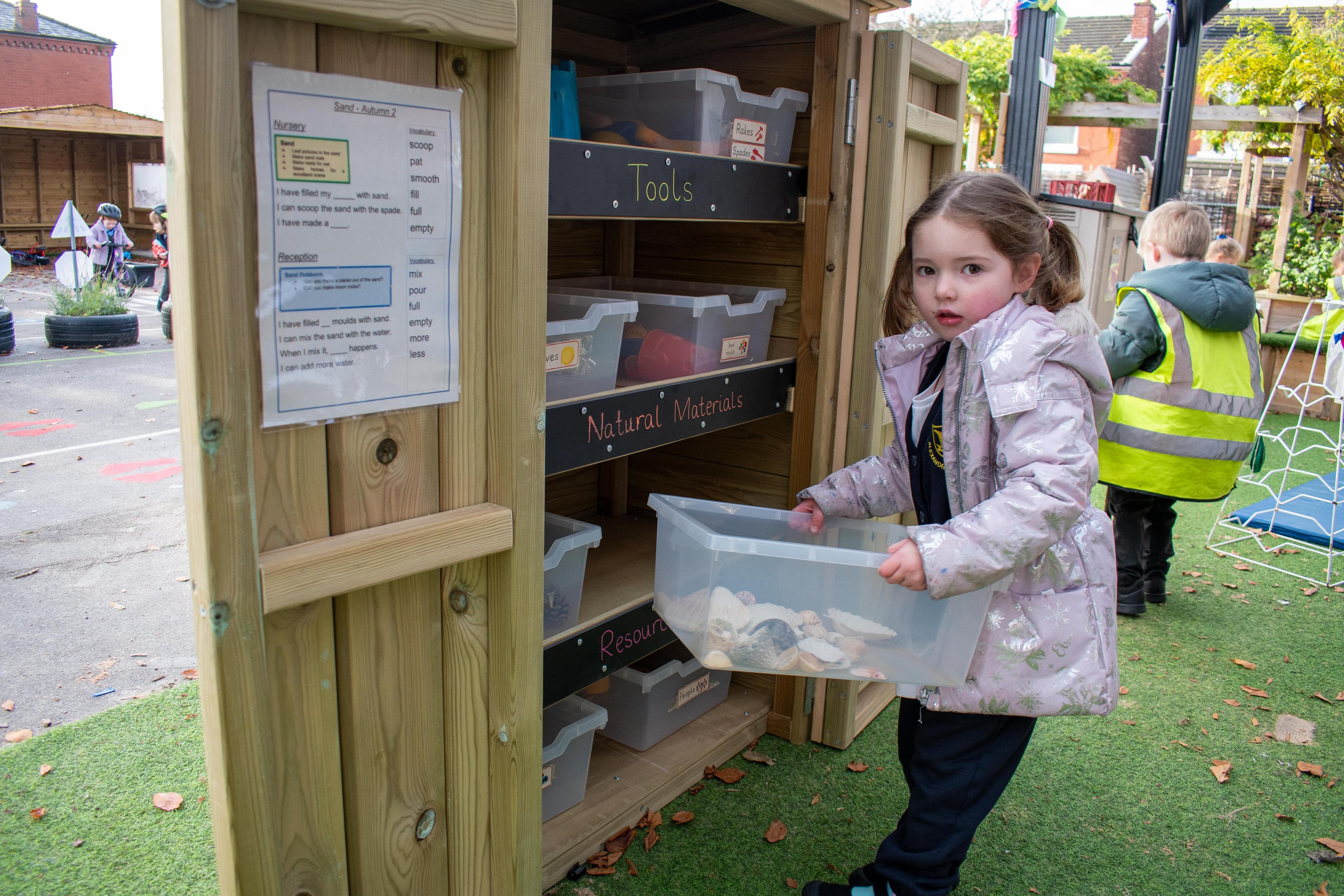 Child sorting out Acorn Storage Unit