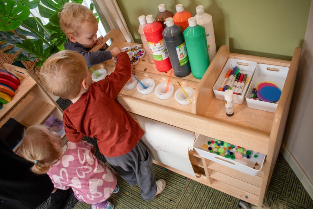 Child being creative with Millhouse Continuous Provision Trolley