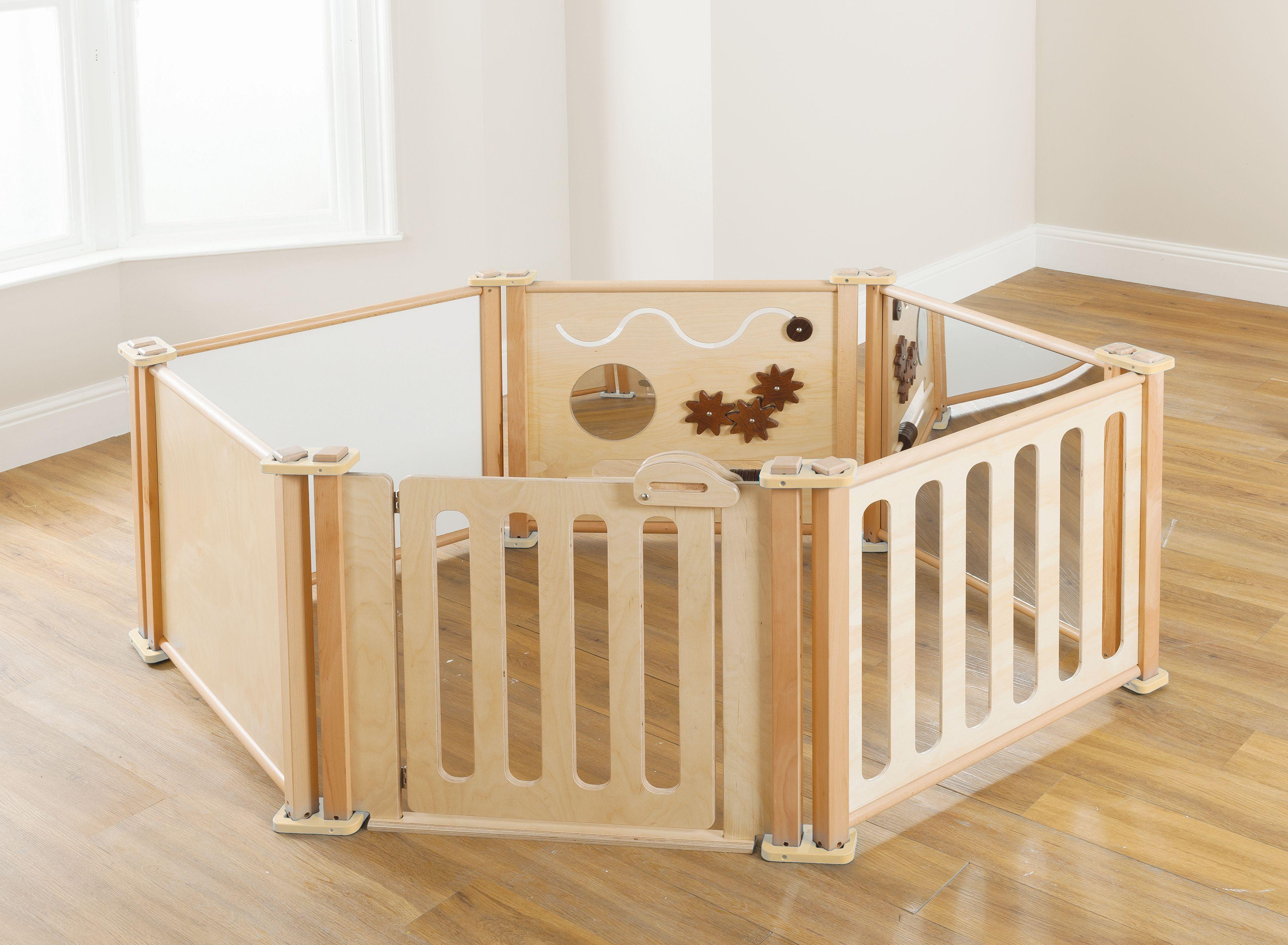 The Toddler Play Panel Starter Set - Enclosure 6 Panel Set has been set up in a classroom. 