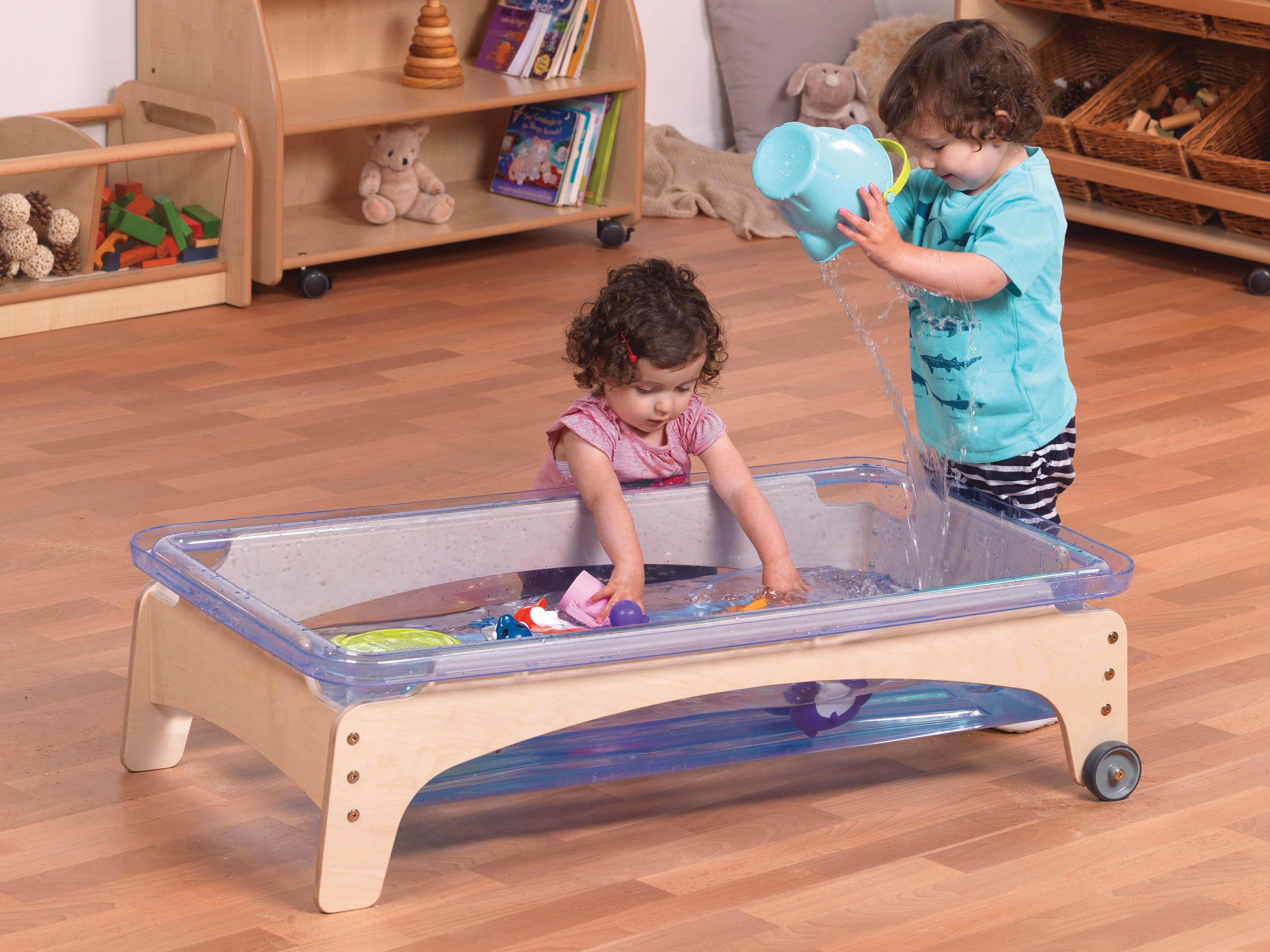 Two toddlers are playing with the Sand & Water Station (290mm), in a classroom.  