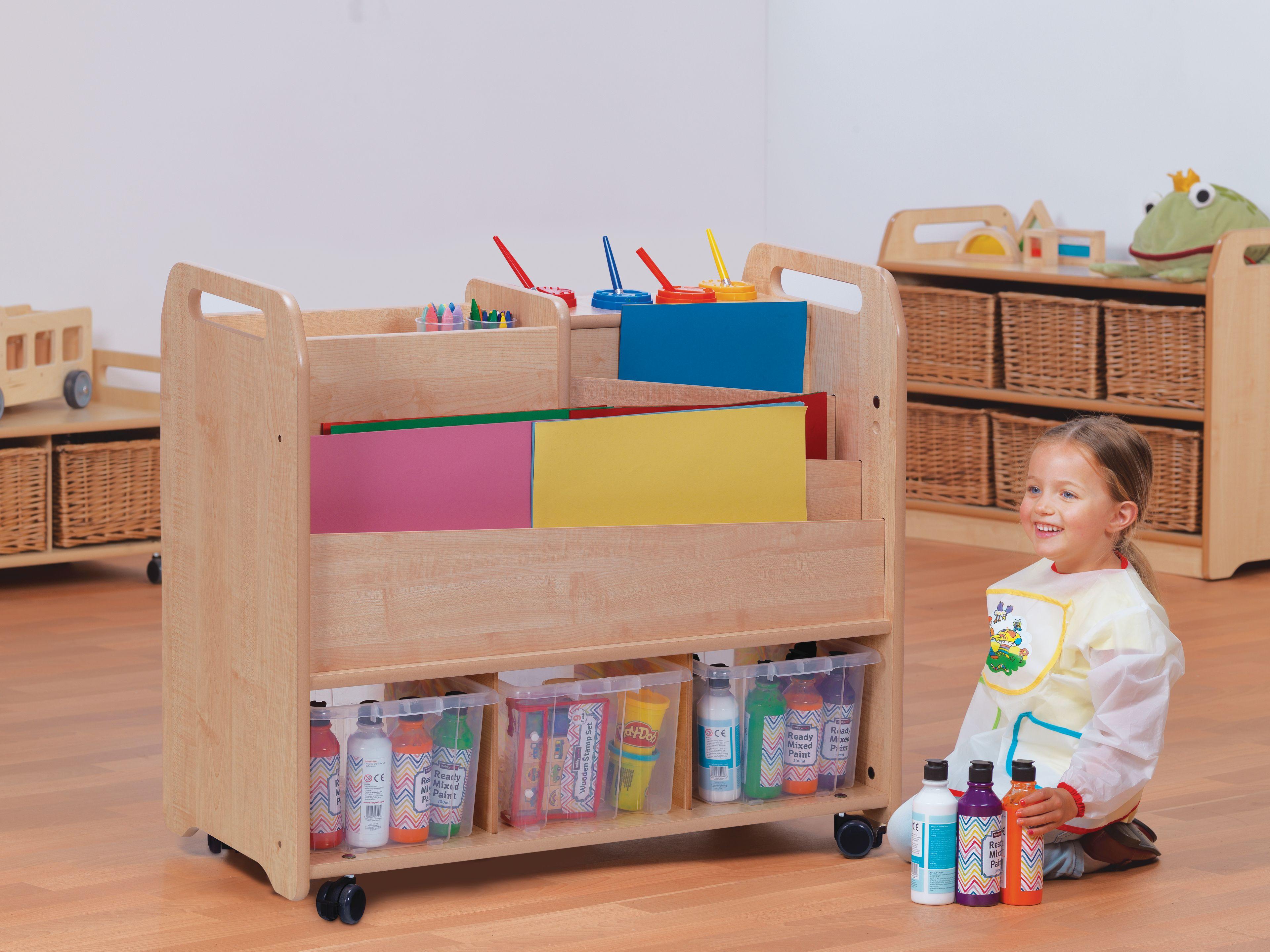 A young girl is choosing arts and crafts supplies from the Double-sided Creative Unit.
