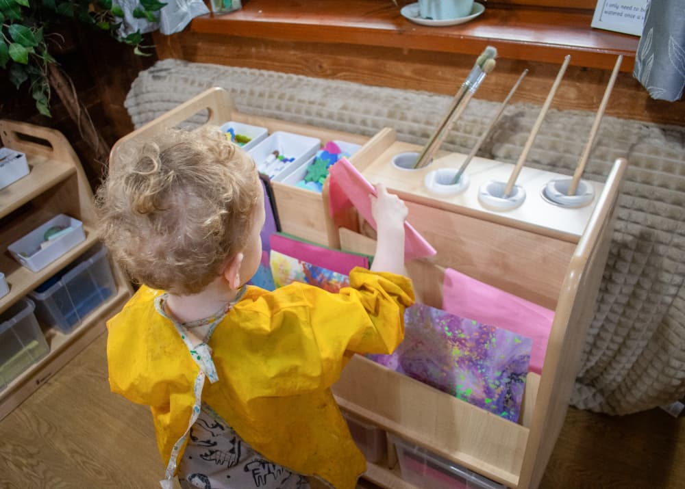 Child rooting through Millhouse Double Sided Creative Unit