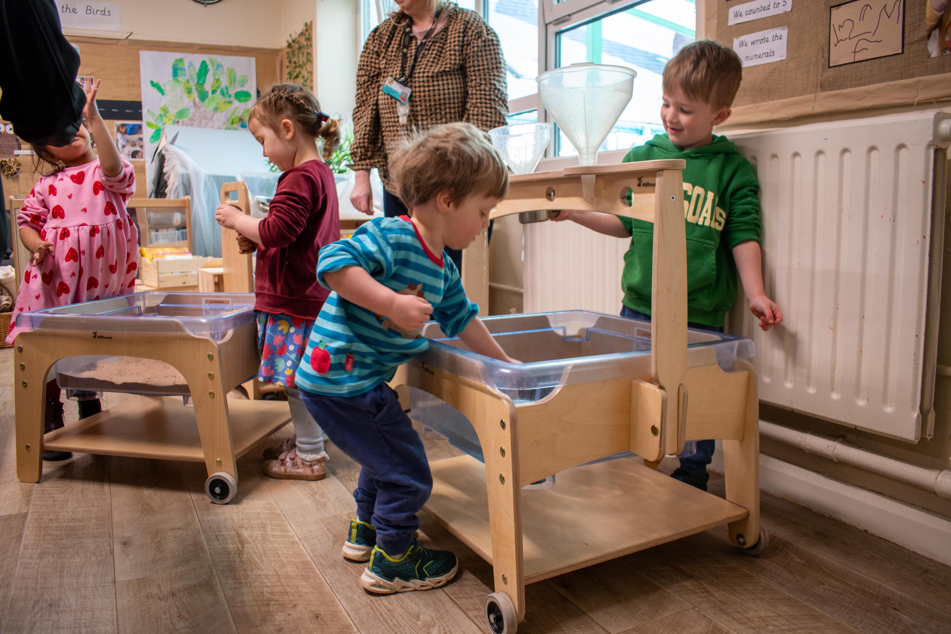 children playing with Millhouse eyfs messy zone
