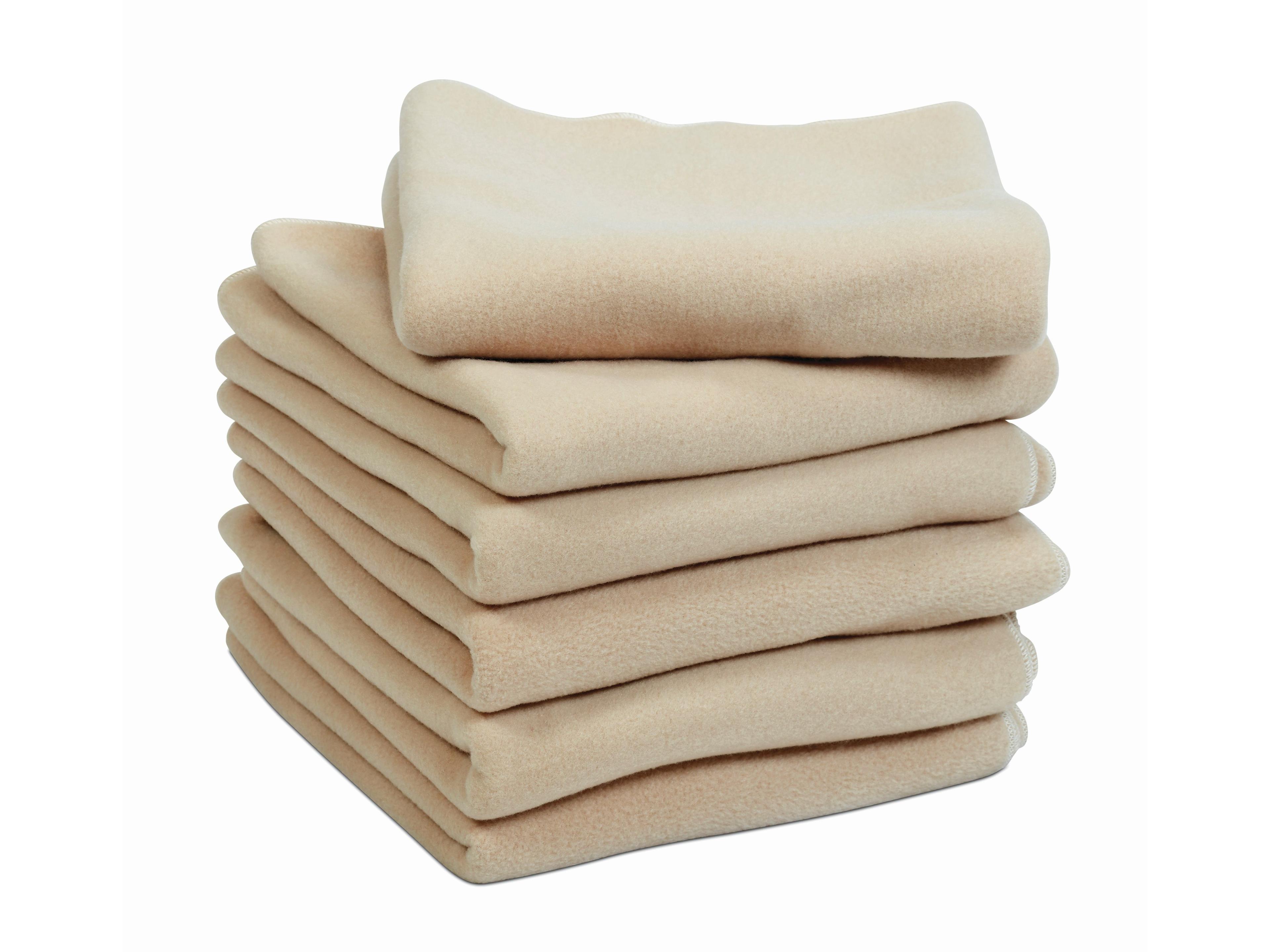 millhouse folded pile of beige blankets