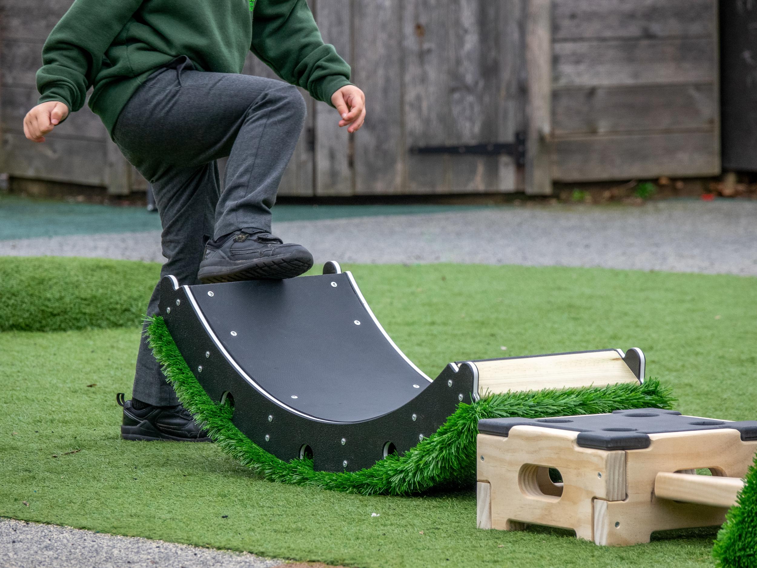 Child walking on rocker