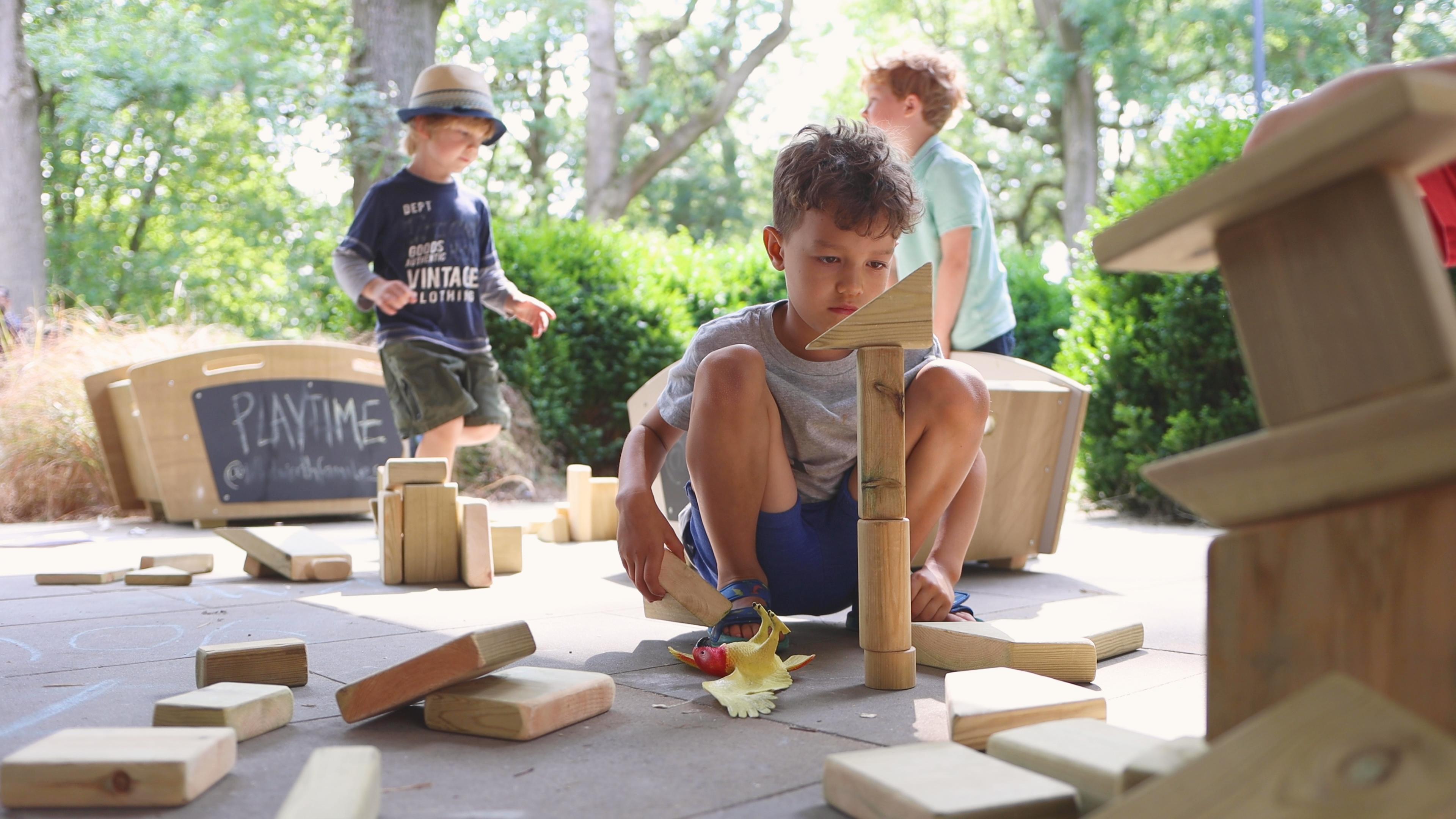 A young boy playing with constructions blocks