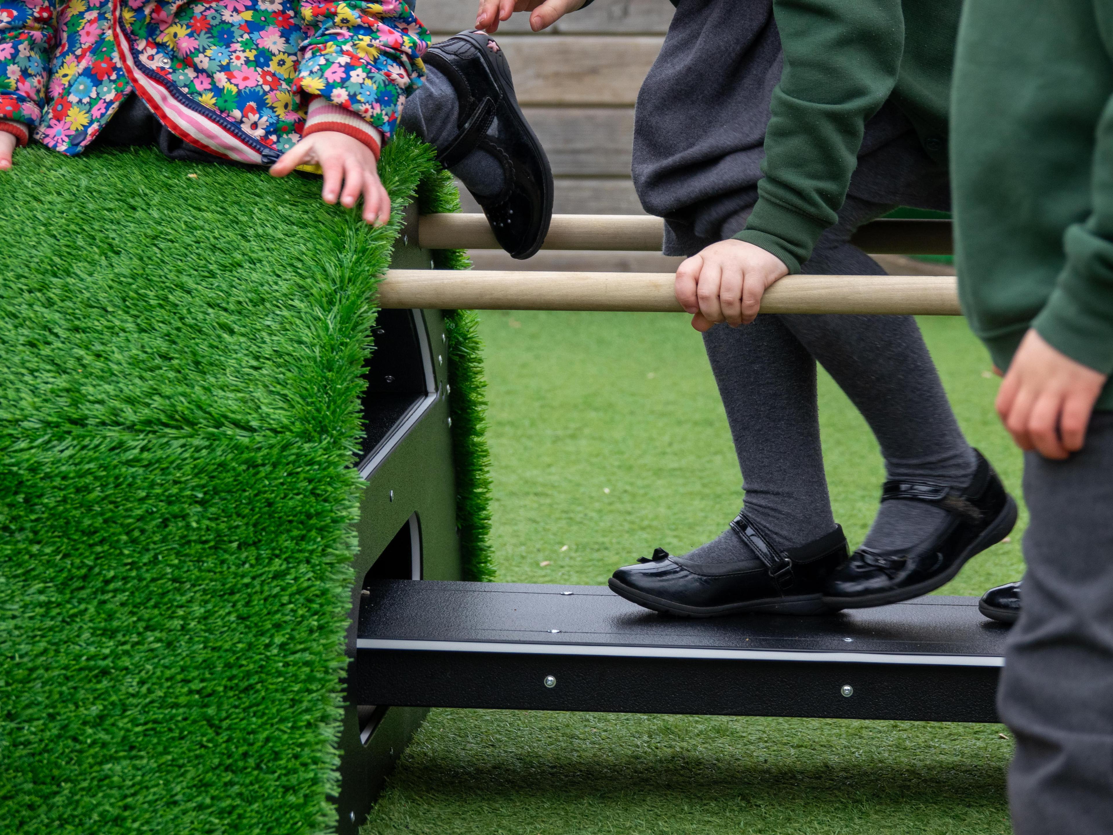 A child's feet balancing on the Rockies