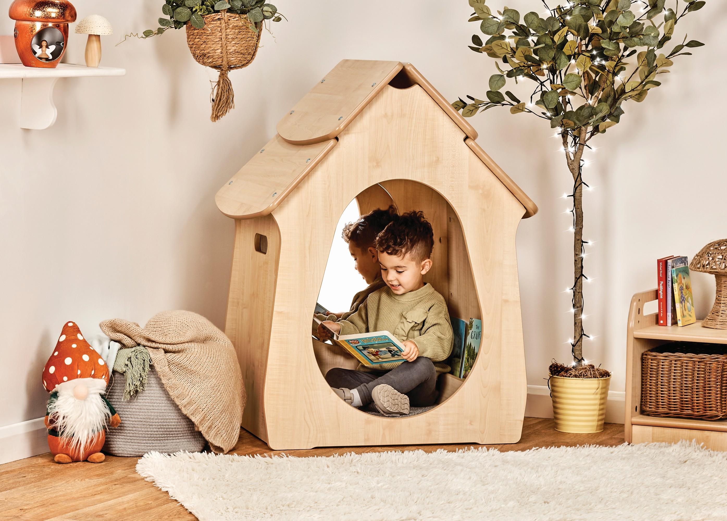 Small quiet corner with soft edges. Used for reading or calm play.
