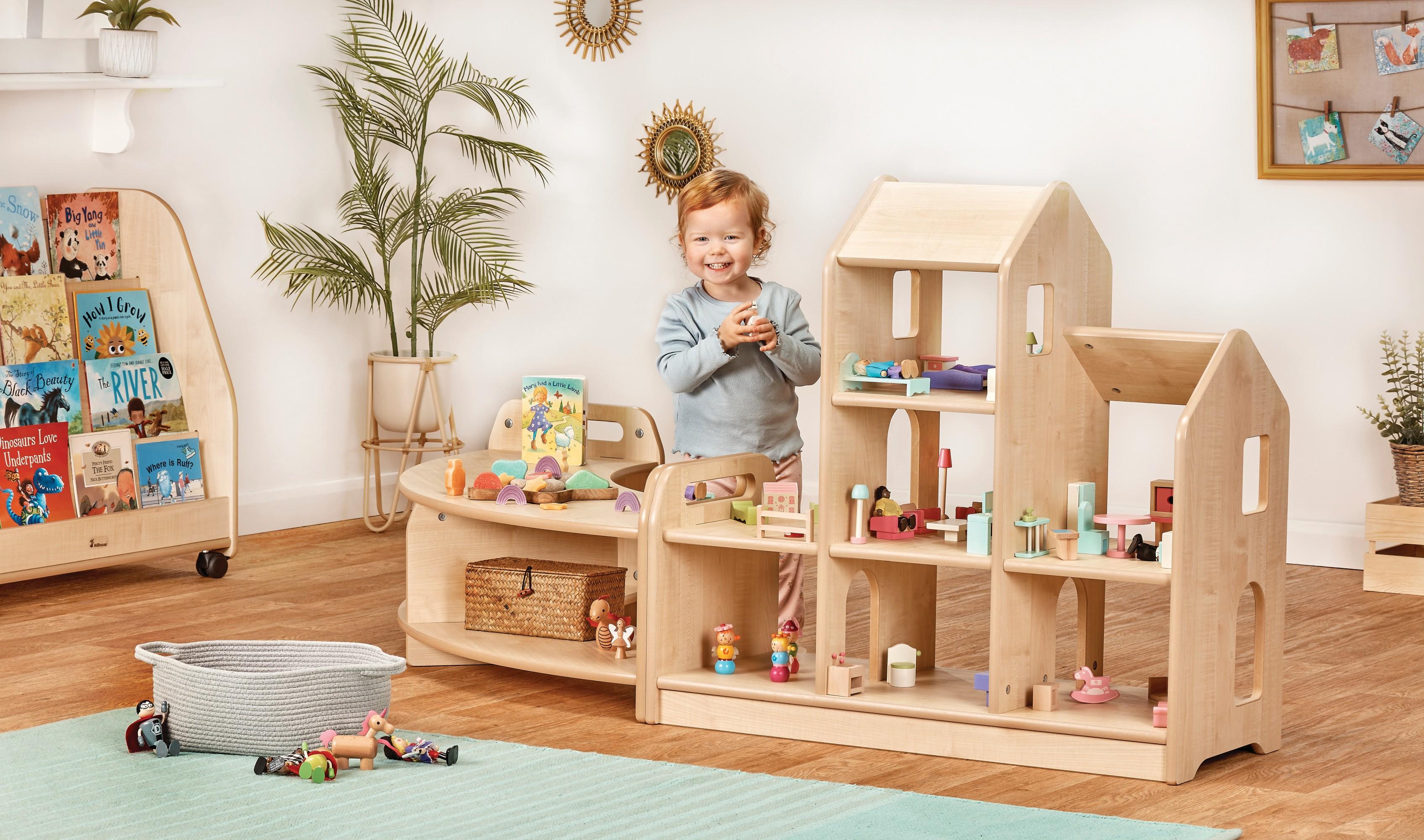 Three-level wooden dollhouse with open sides. Children can play with dolls together.