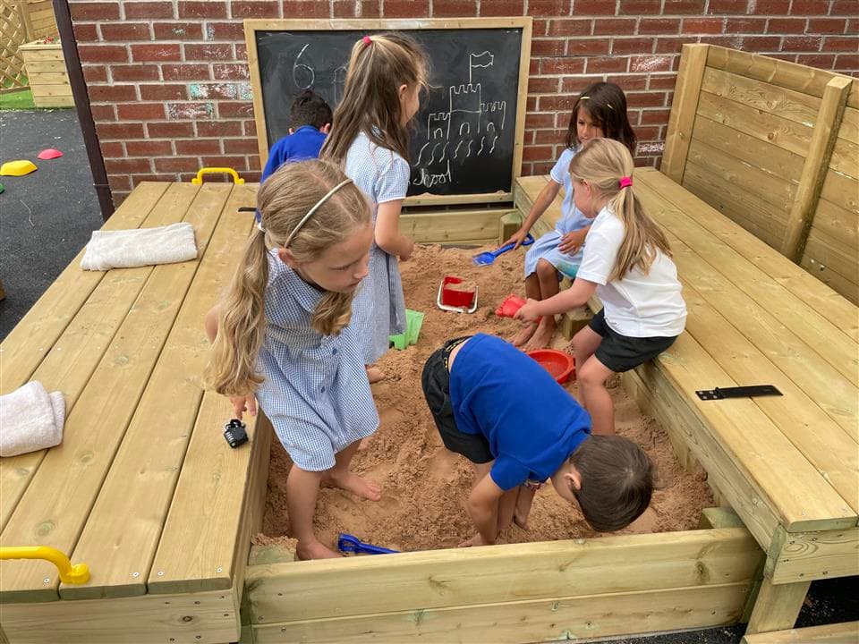 children playing in our small sandbox
