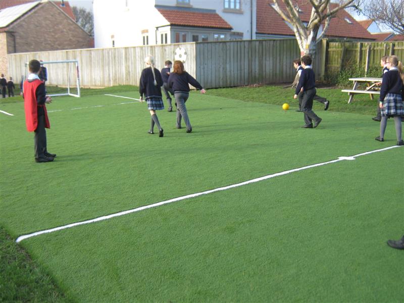 Children enjoy football on Wolviston's Multi Use Games Area